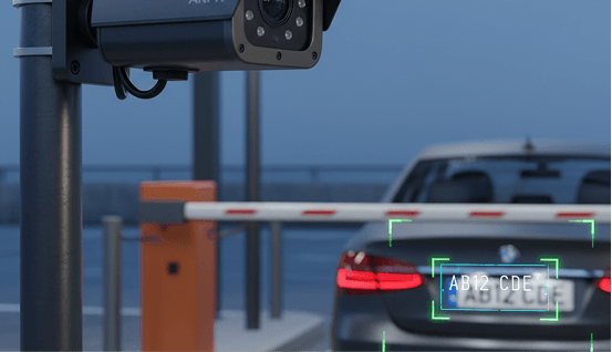 ANPR camera scanning a vehicle licence plate at a parking gate